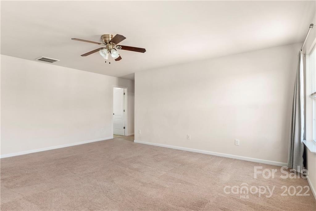 2831 Turquoise Circle Davidson, NC 28036 - Photo 22 of 44 a view of a room with a ceiling fan and window