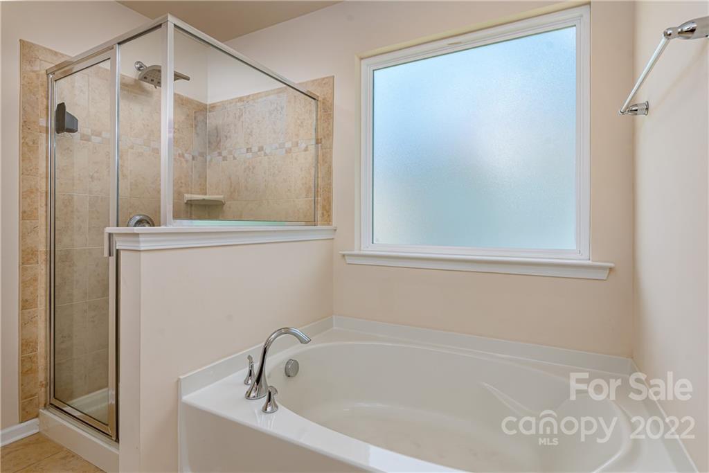 2831 Turquoise Circle Davidson, NC 28036 - Photo 25 of 44 a white bath tub sitting next to a shower