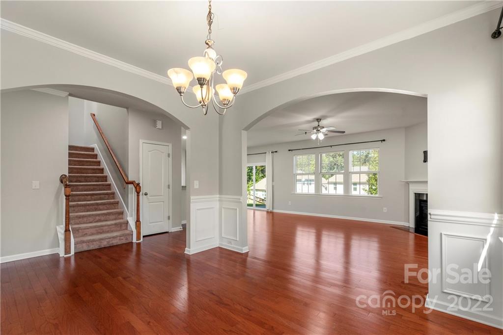 2831 Turquoise Circle Davidson, NC 28036 - Photo 4 of 44 a view of an empty room with wooden floor and a window