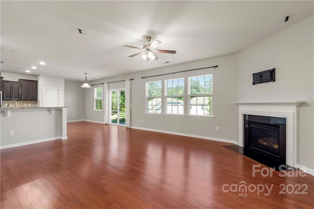 2831 Turquoise Circle Davidson, NC 28036 - Photo 6 of 44 a view of an empty room with window and wooden floor