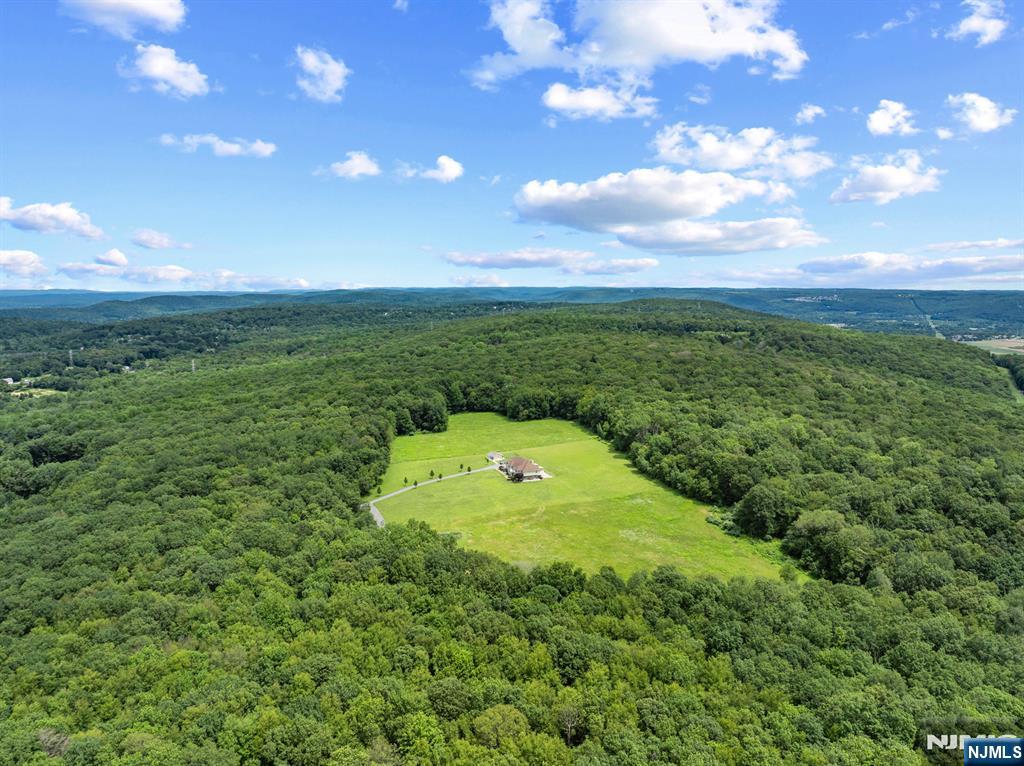 464 Mt Bethel Road Oxford, NJ 07863 - Photo 4 of 31 a view of a garden with a projector