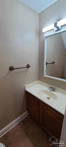 a room with a sink and a mirror