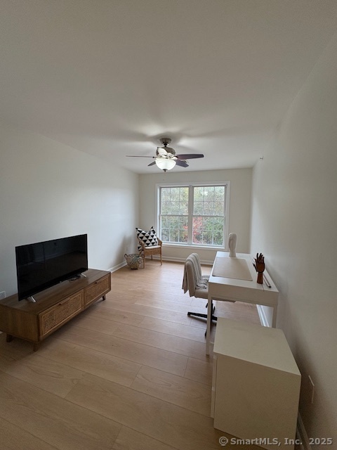 130 Meridian Street, Unit 311 Groton, CT 06340 - Photo 11 of 18 a living room with furniture and a large window