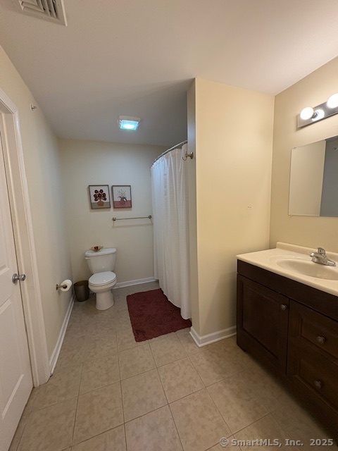 130 Meridian Street, Unit 311 Groton, CT 06340 - Photo 12 of 18 a bathroom with a sink a toilet and shower