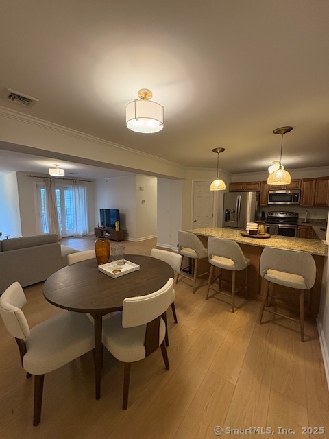 130 Meridian Street, Unit 311 Groton, CT 06340 - Photo 3 of 18 a view of a dining room with furniture
