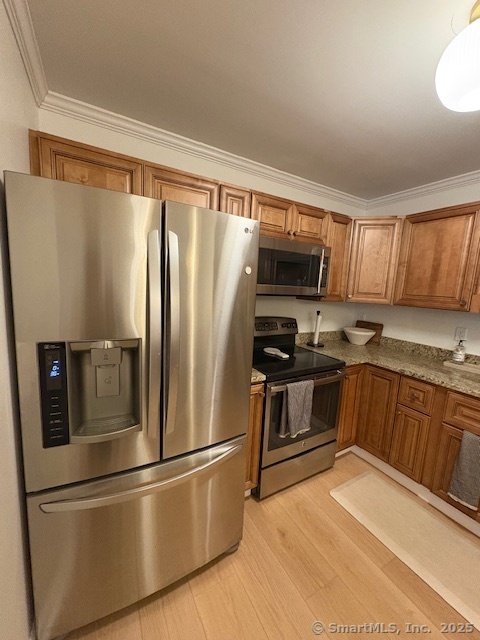 130 Meridian Street, Unit 311 Groton, CT 06340 - Photo 7 of 18 a kitchen with stainless steel appliances granite countertop a refrigerator stove top oven and sink
