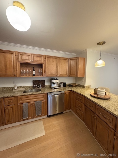 130 Meridian Street, Unit 311 Groton, CT 06340 - Photo 8 of 18 a kitchen with stainless steel appliances granite countertop a sink and cabinets