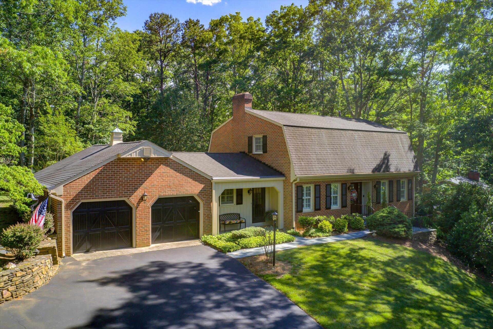 5057 Falcon Ridge Road Roanoke, VA 24018 - Photo 1 of 43 a front view of a house with a yard