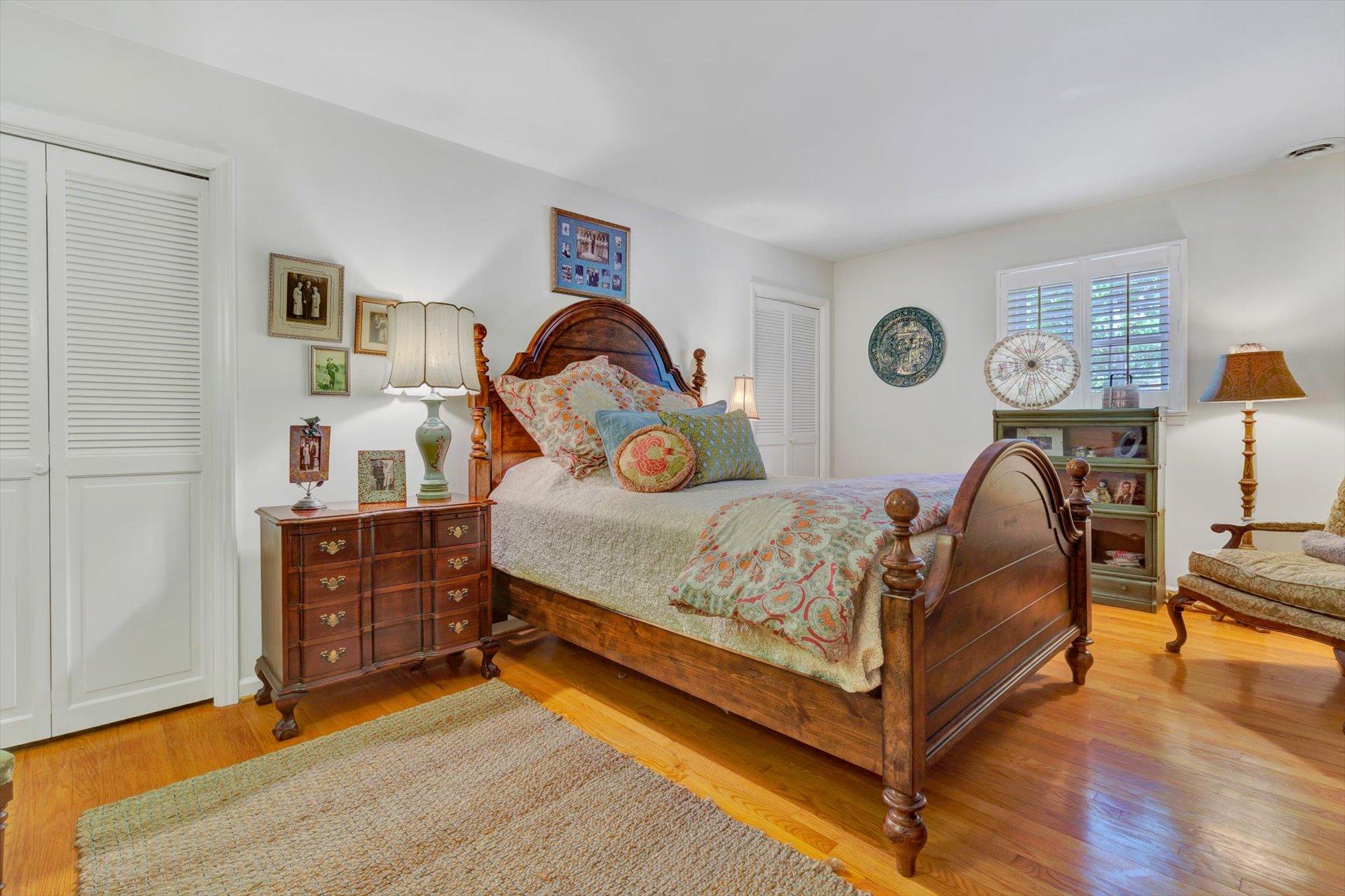 5057 Falcon Ridge Road Roanoke, VA 24018 - Photo 23 of 43 a bedroom with a bed and a chandelier