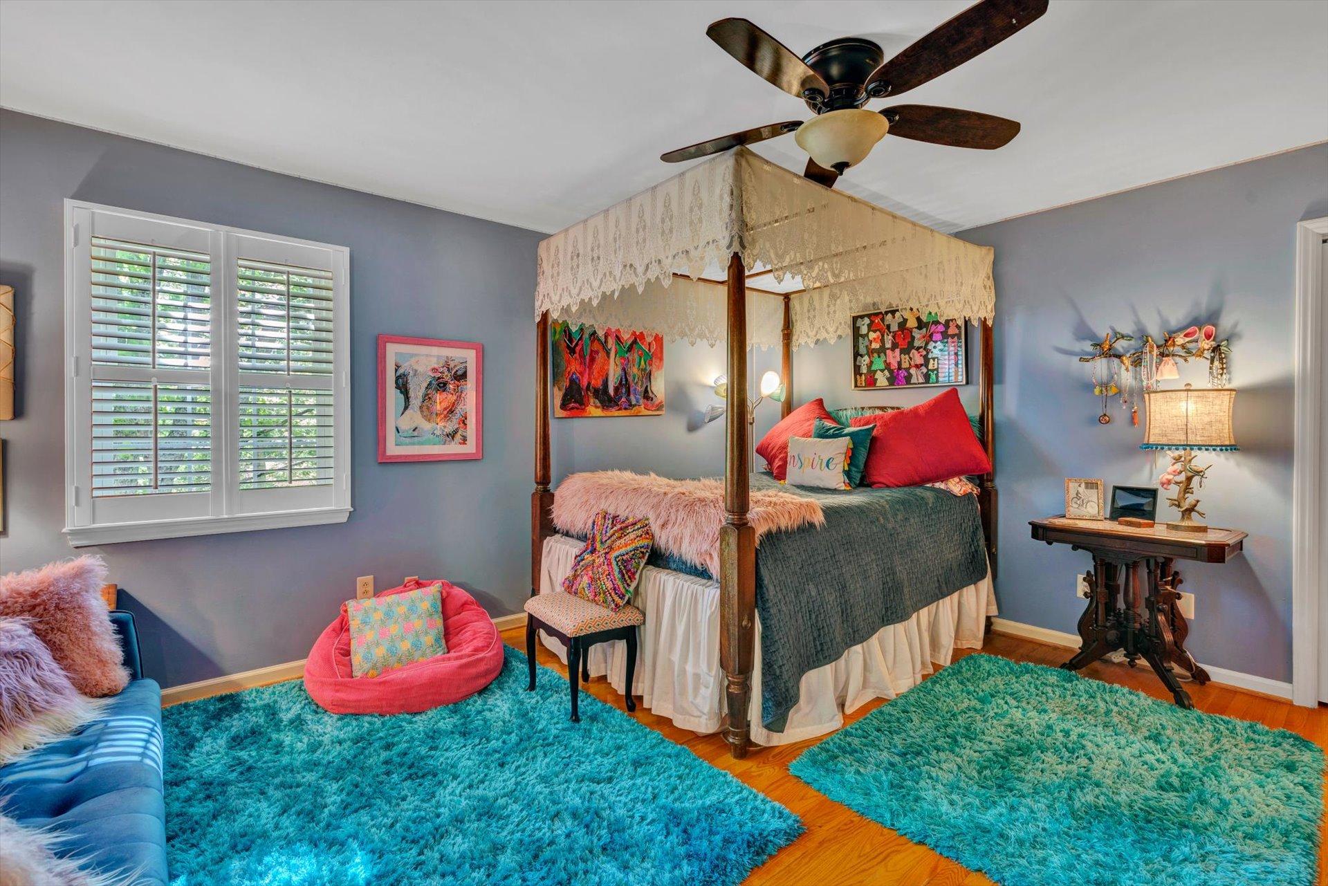 5057 Falcon Ridge Road Roanoke, VA 24018 - Photo 26 of 43 a bedroom with bed and a chandelier