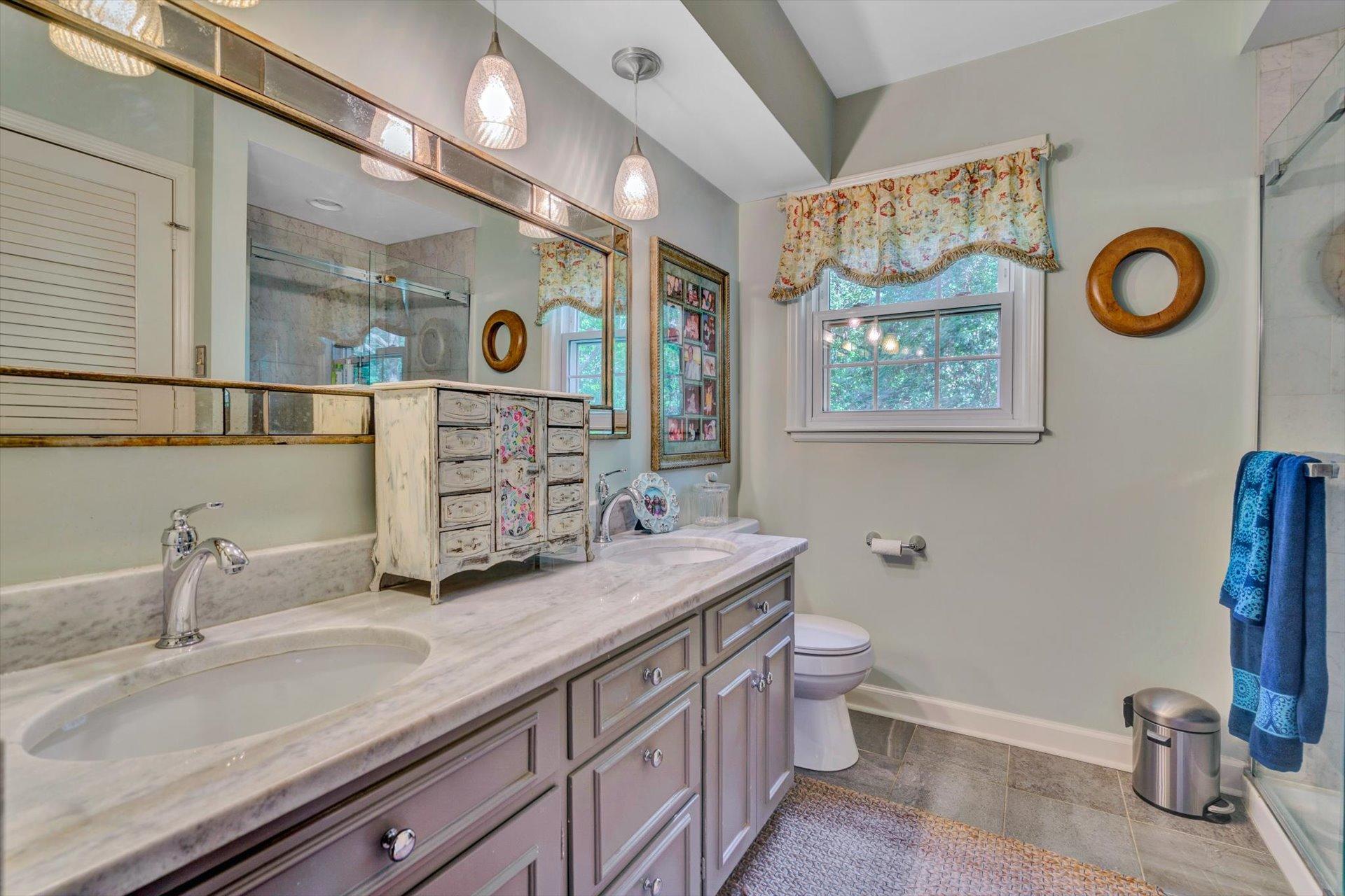 5057 Falcon Ridge Road Roanoke, VA 24018 - Photo 28 of 43 a bathroom with a toilet a sink and mirror