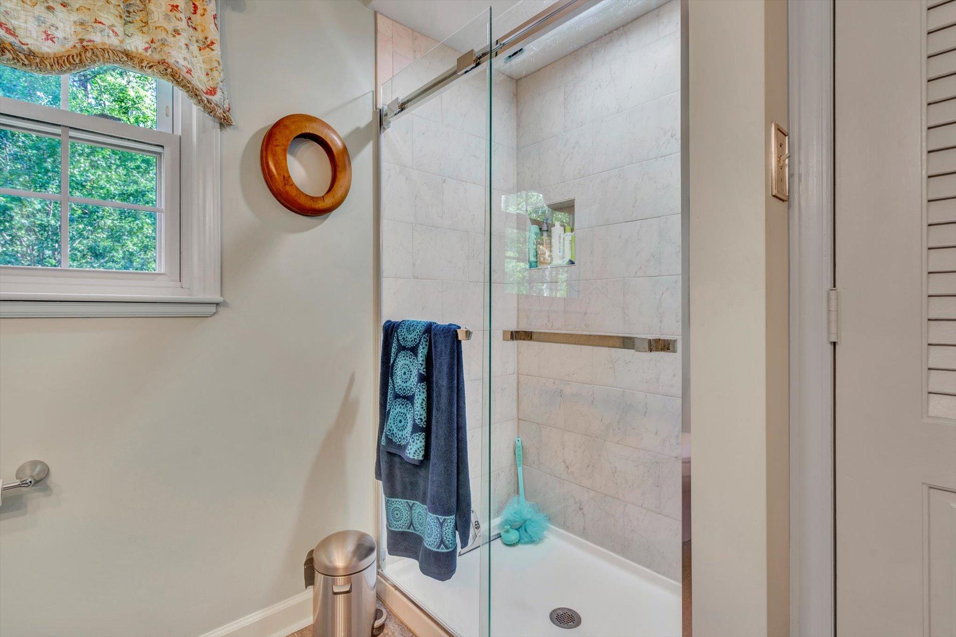 5057 Falcon Ridge Road Roanoke, VA 24018 - Photo 29 of 43 a bathroom with a window and a shower