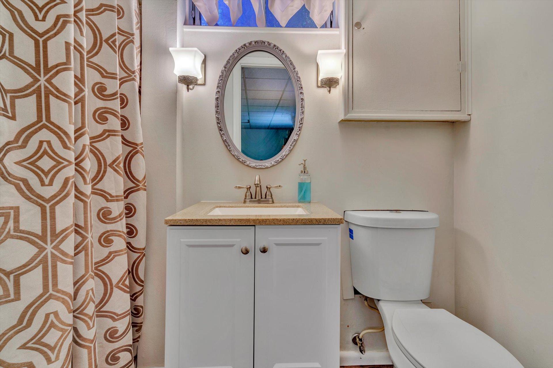 5057 Falcon Ridge Road Roanoke, VA 24018 - Photo 37 of 43 a bathroom with a toilet sink and mirror