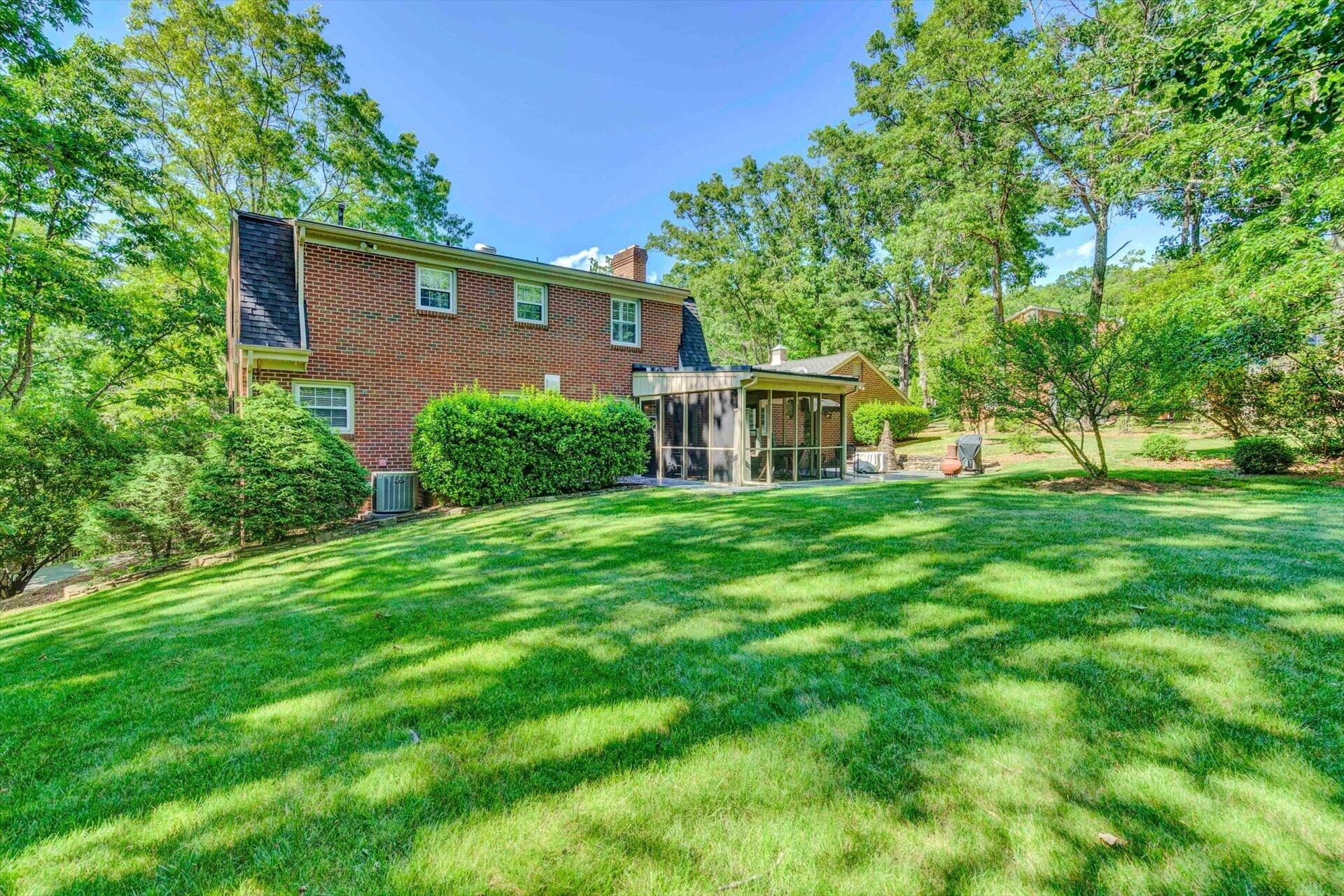 5057 Falcon Ridge Road Roanoke, VA 24018 - Photo 42 of 43 a view of a house with backyard and a tree