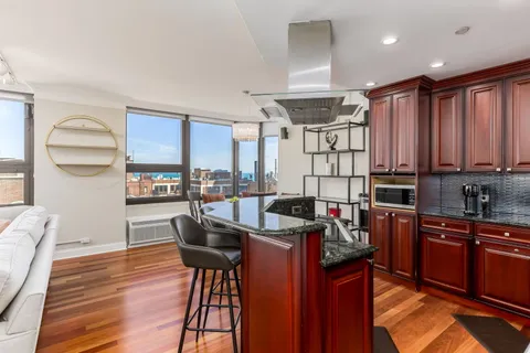 a view of a kitchen and dining room
