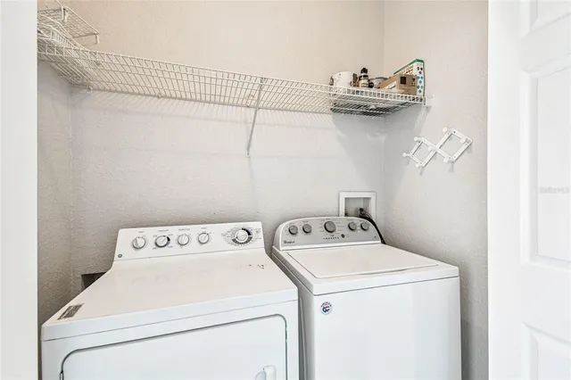 a utility room with dryer and washer