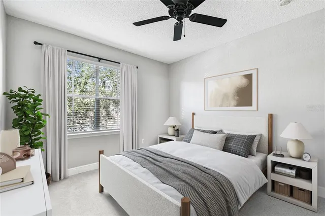 a bedroom with a large bed and a window