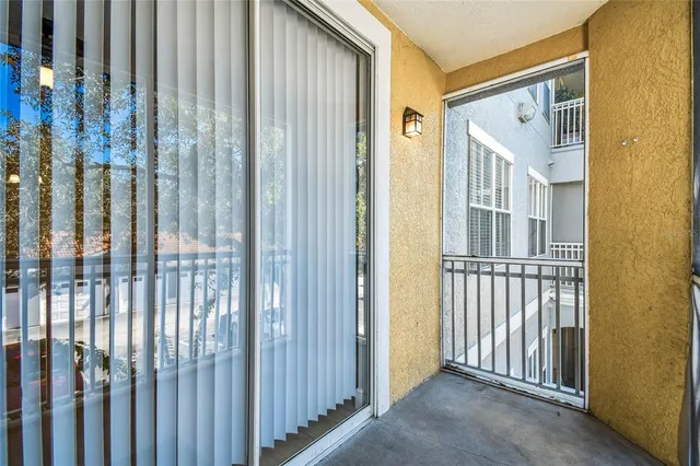 a view of a porch with wooden floor