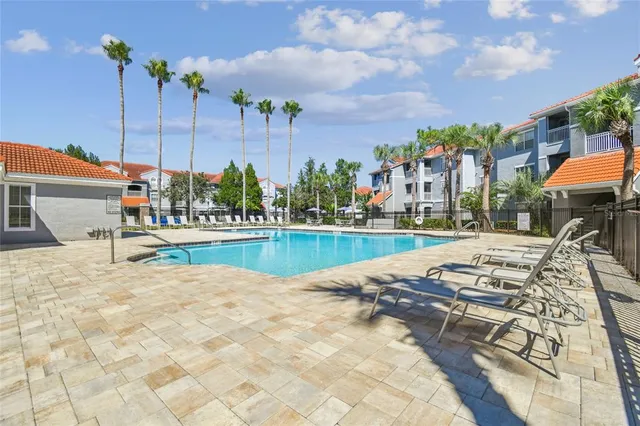 a view of a swimming pool with a patio