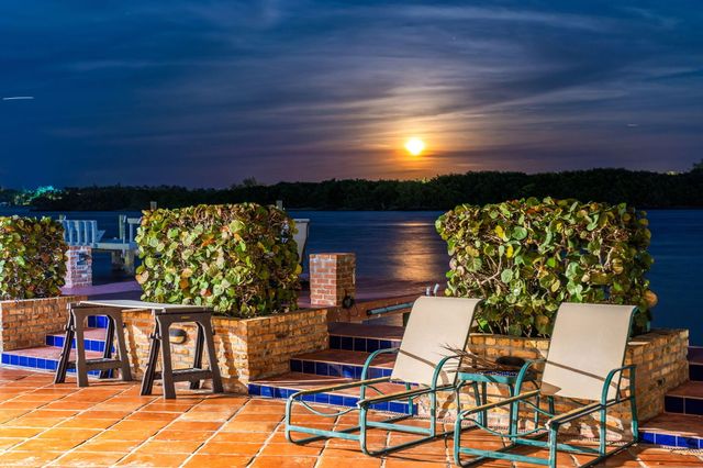 a view of a chairs and table in a patio