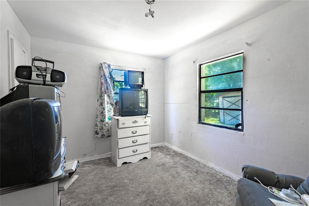 6281 Southeast Hames Road Belleview, FL 34420 - Photo 8 of 16 a room with furniture and a window