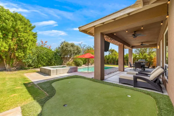 a view of a patio with swimming pool