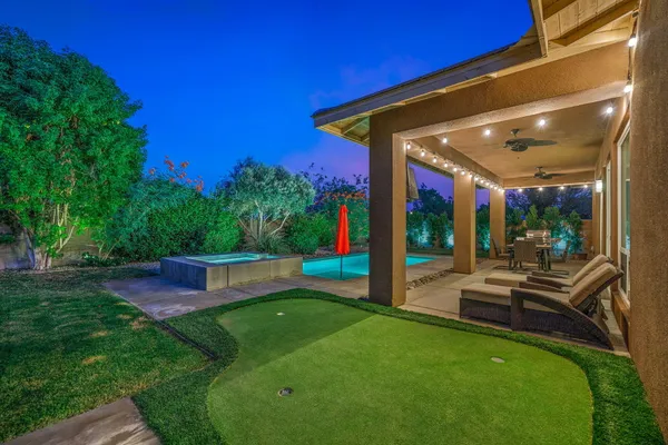 a view of swimming pool with a patio