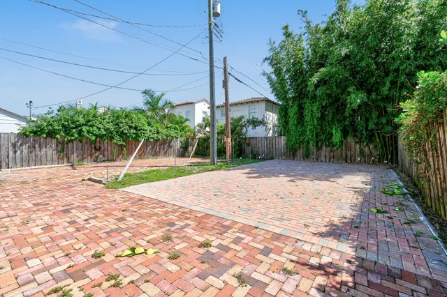 a view of a backyard with a tree