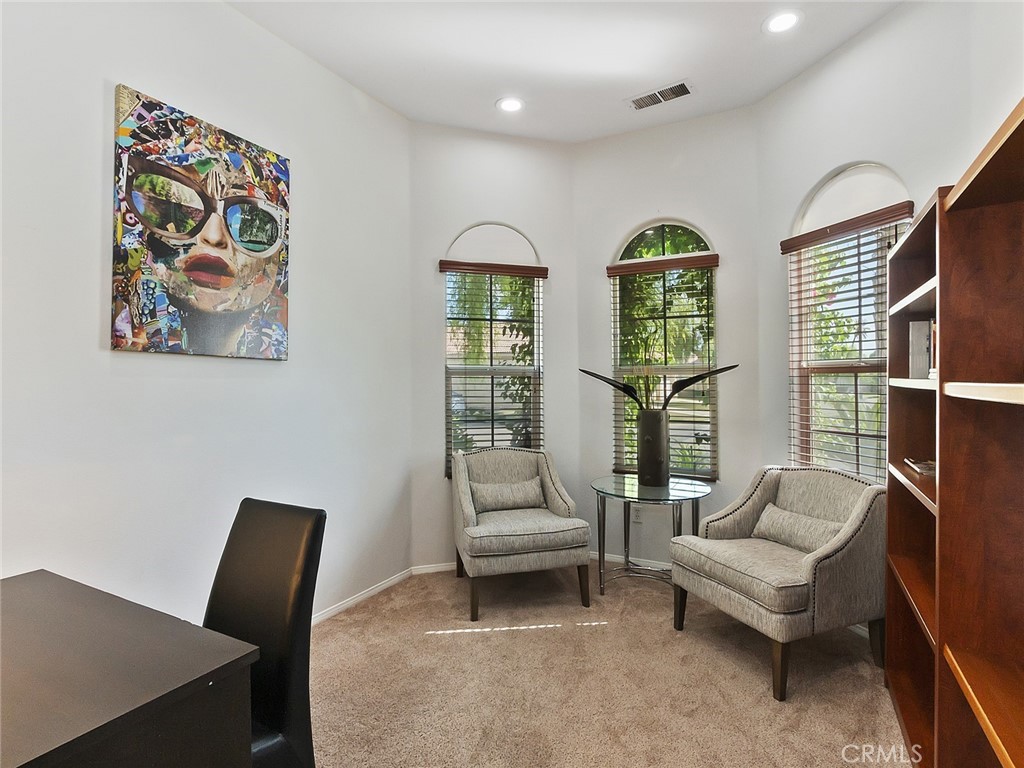 48957 Heifitz Drive Indio, CA 92201 - Photo 18 of 34 a living room with furniture and a large window