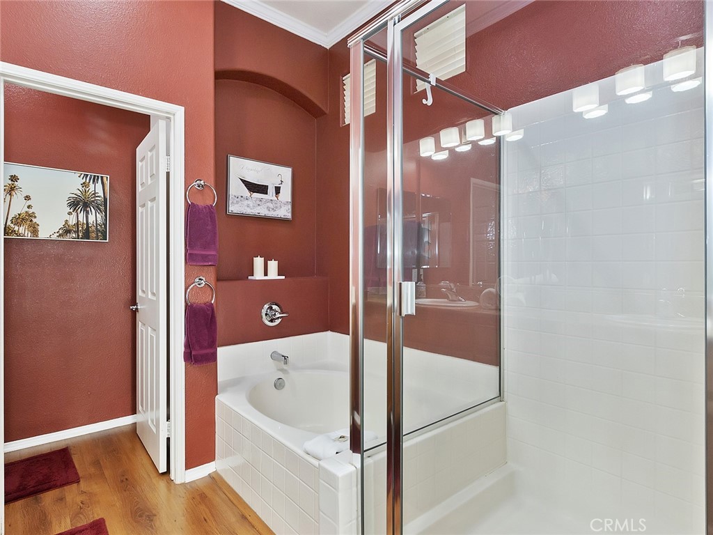 48957 Heifitz Drive Indio, CA 92201 - Photo 23 of 34 a bathroom with a bathtub and a shower