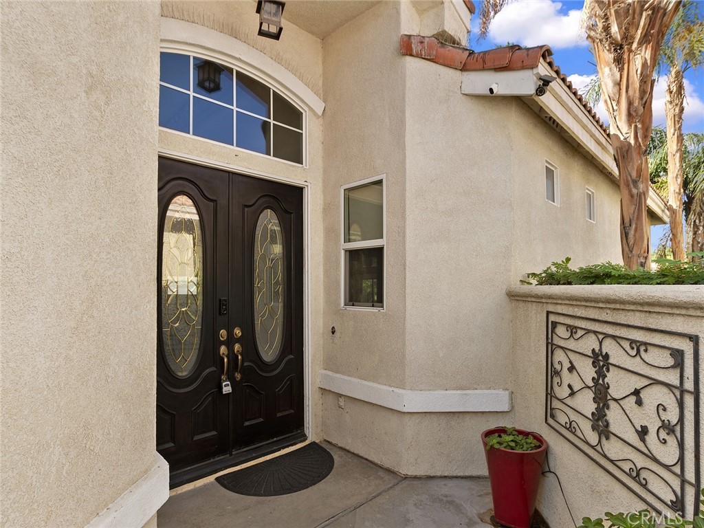 48957 Heifitz Drive Indio, CA 92201 - Photo 30 of 34 a front view of a house with entryway
