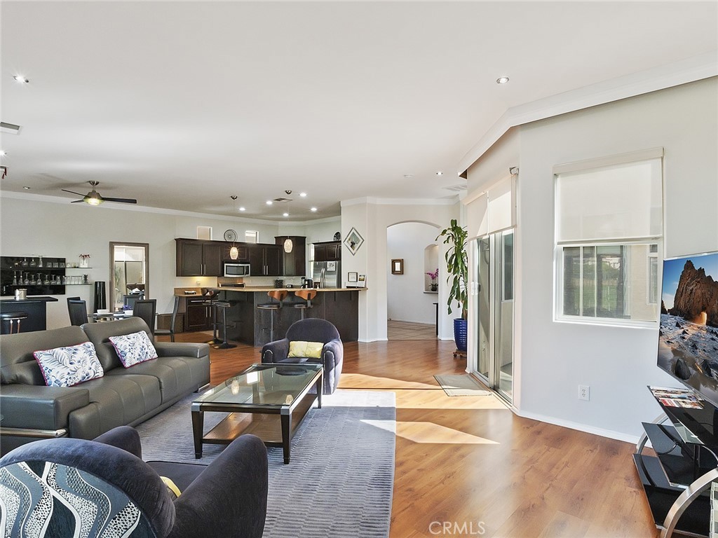 48957 Heifitz Drive Indio, CA 92201 - Photo 3 of 34 a living room with furniture and a fireplace