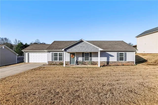 front view of a house with a yard