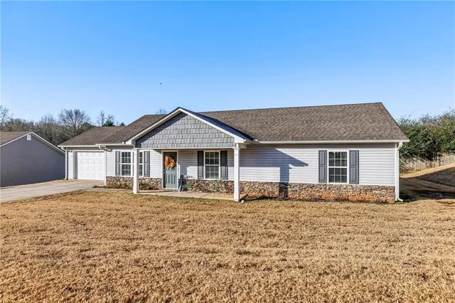 front view of a house with a yard