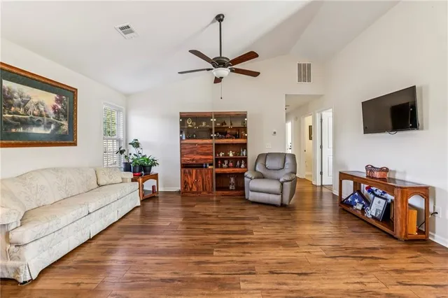 a living room with furniture or couch and a flat screen tv