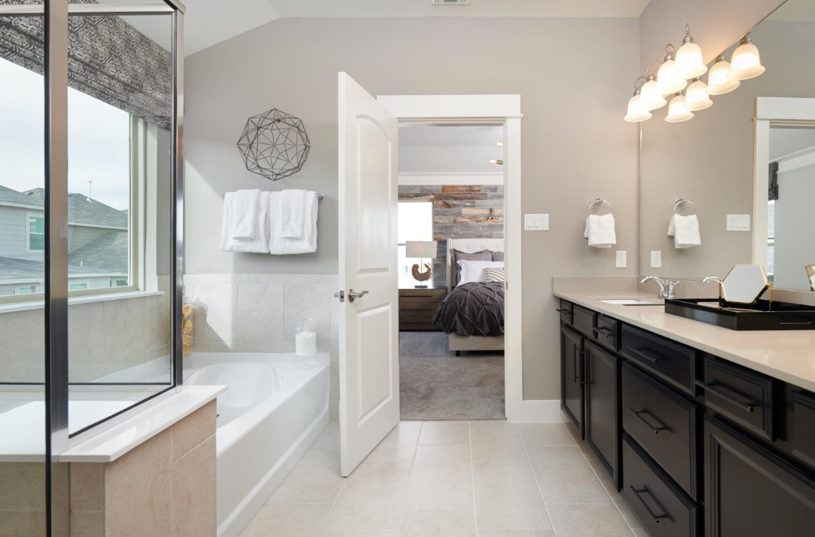 112 Leon Loop Liberty Hill, TX 78642 - Photo 6 of 12 Glamour Bath looking into serene Primary Bedroom