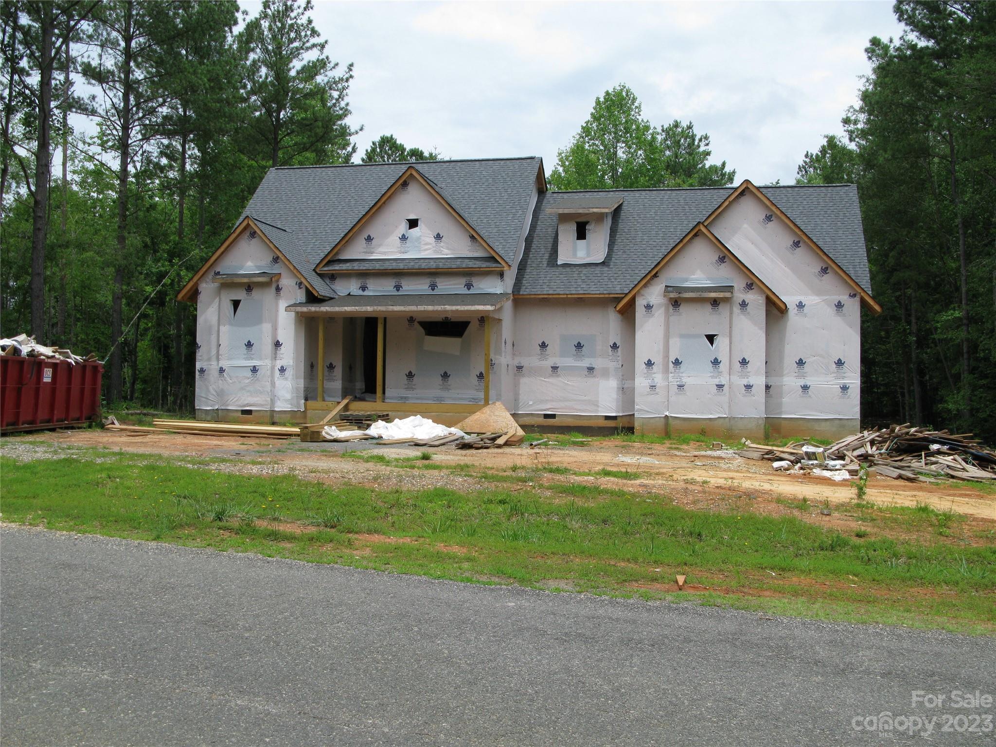 772 Bellegray Road, Unit 10 Clover, SC 29710 - Photo 1 of 9 a view of a white house with a big yard and large trees
