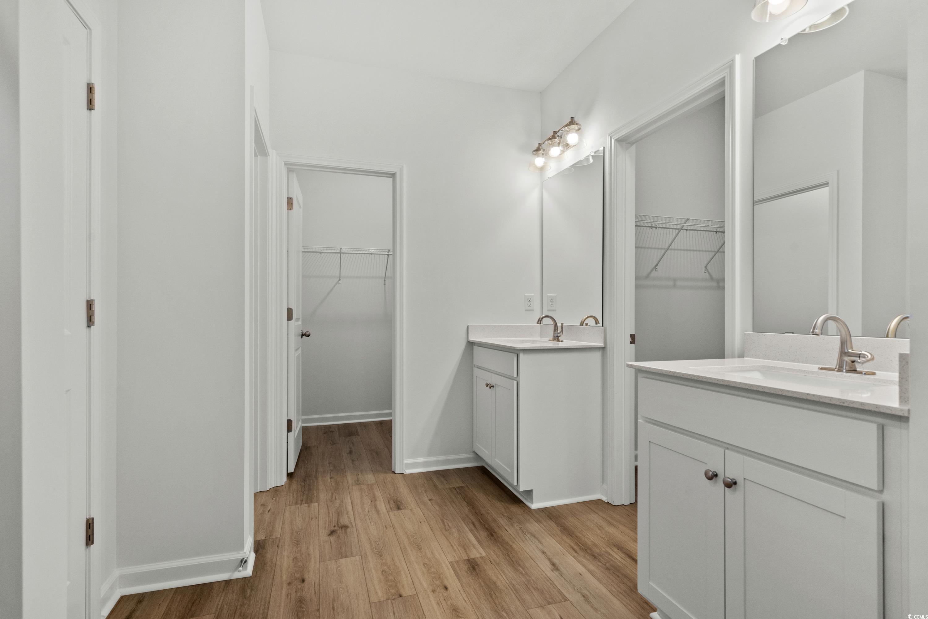 444 Sun Colony Boulevard Longs, SC 29568 - Photo 18 of 31 Primary bathroom with double vanity with quartz countertops, and two walk in closets.
