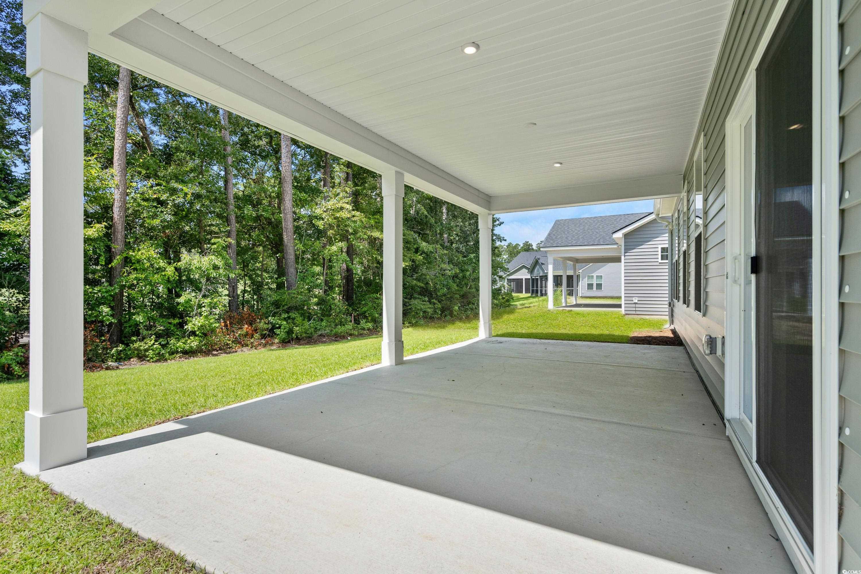 444 Sun Colony Boulevard Longs, SC 29568 - Photo 25 of 31 Rear extended covered porch, with a golf course view.
