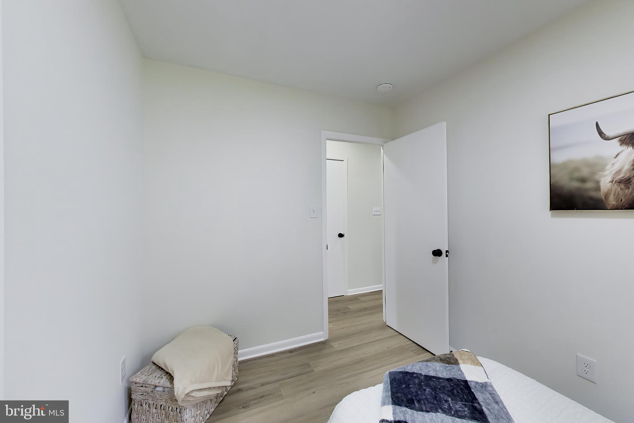 11309 Keystone Avenue Clinton, MD 20735 - Photo 18 of 36 a view of empty room with wooden floor