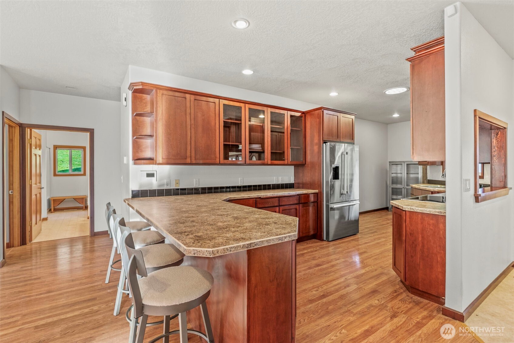 303 Shadow Mountain Road Silverlake, WA 98645 - Photo 13 of 39 a open kitchen with stainless steel appliances granite countertop a refrigerator and a stove top oven