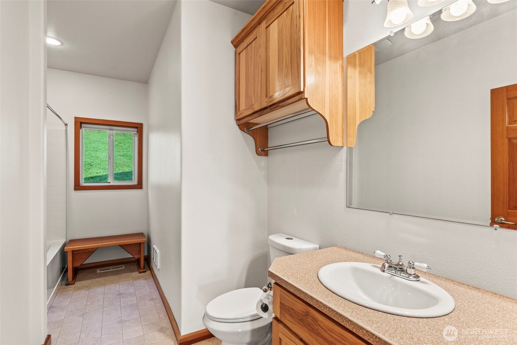 303 Shadow Mountain Road Silverlake, WA 98645 - Photo 22 of 39 a bathroom with a sink a toilet and a mirror