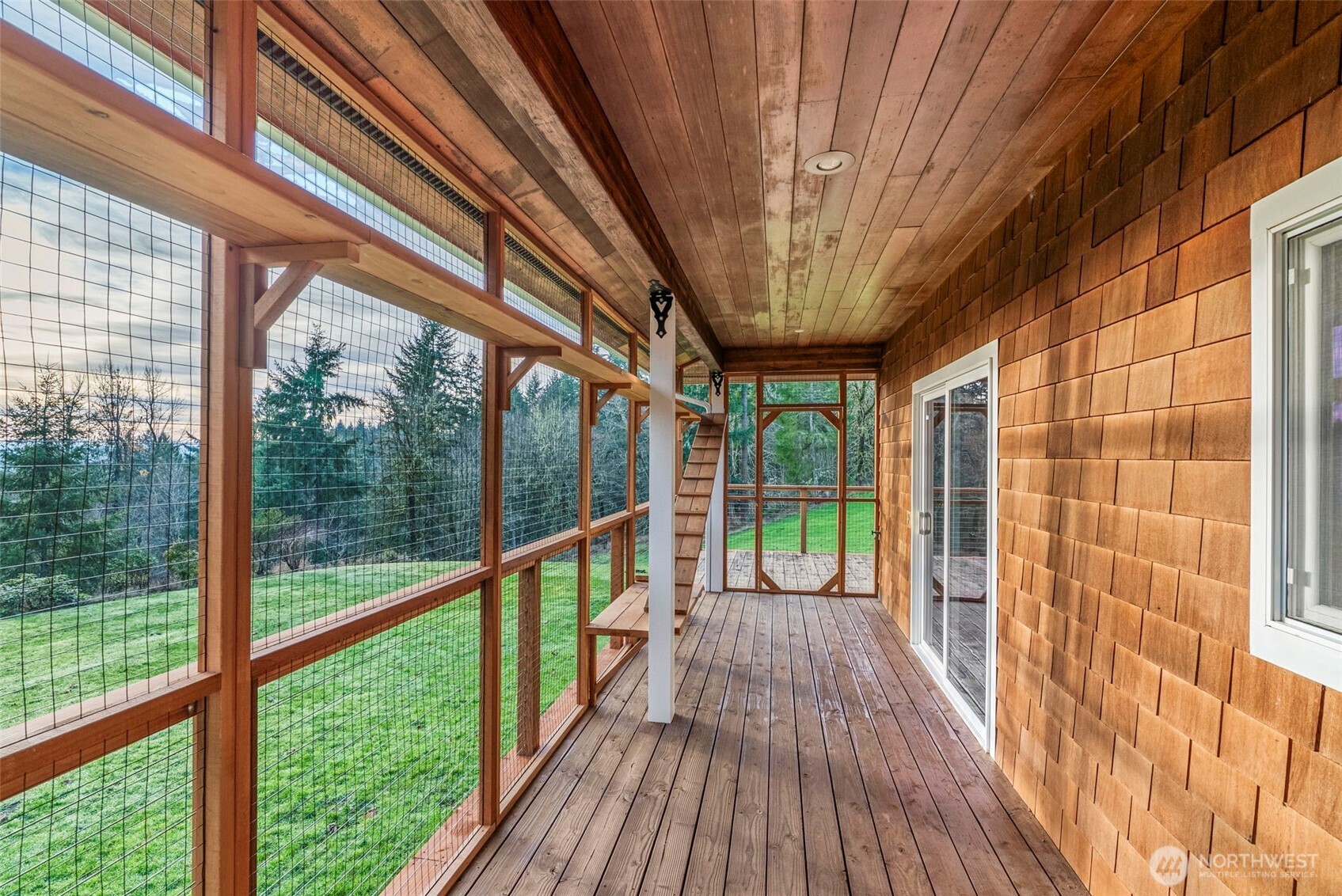 303 Shadow Mountain Road Silverlake, WA 98645 - Photo 6 of 39 a view of a balcony with wooden floor