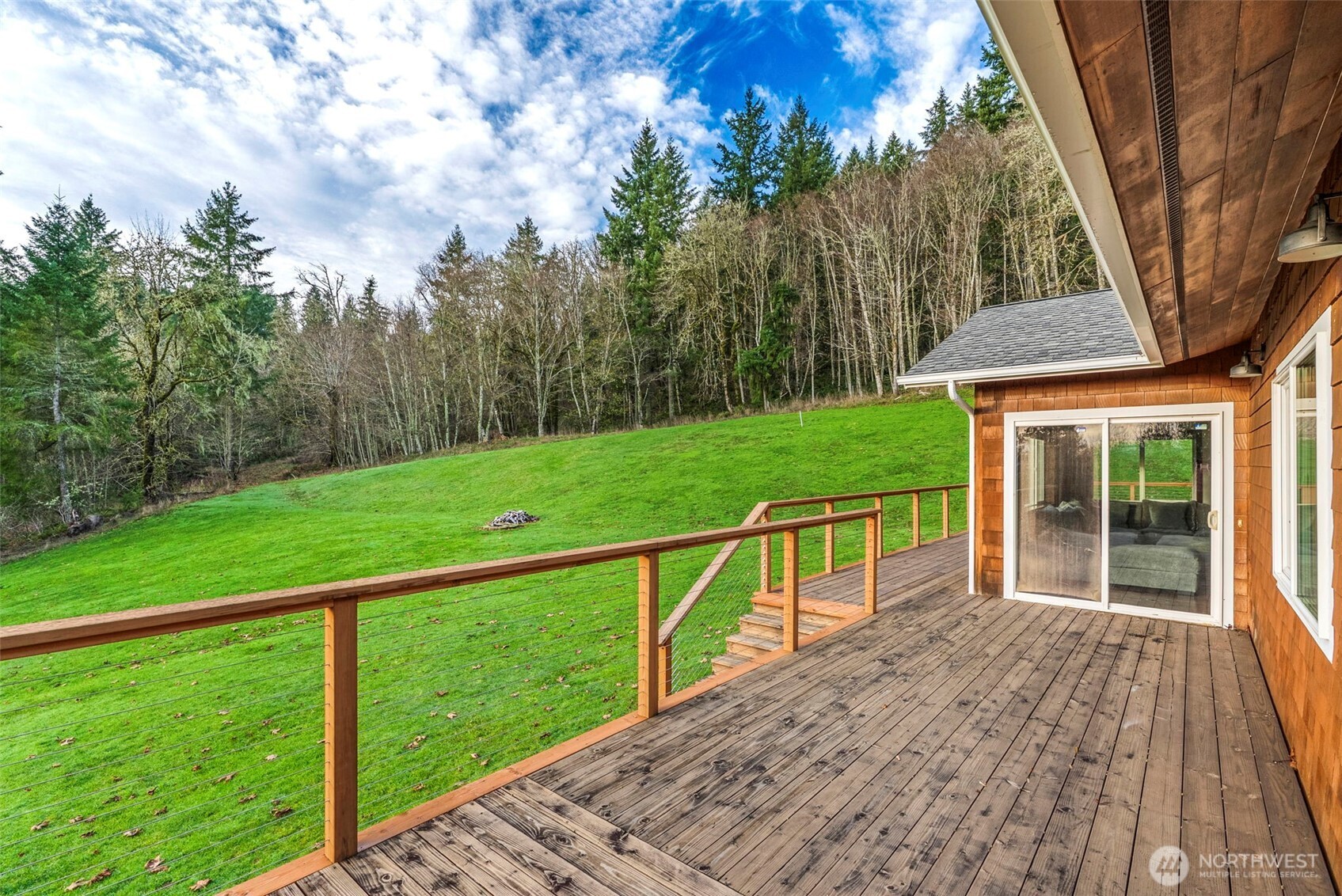 303 Shadow Mountain Road Silverlake, WA 98645 - Photo 8 of 39 a view of a wooden deck and a yard