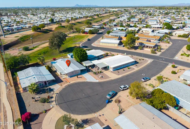 an aerial view of residential houses with outdoor space