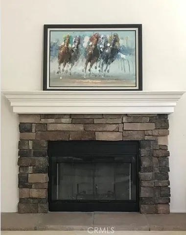 a close view of fireplace and a painting on the wall
