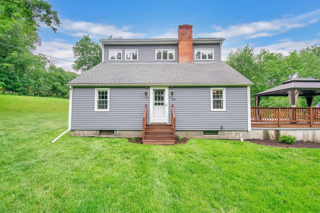 130 Warren Road Brimfield, MA 01010 - Photo 1 of 29 a front view of a house with a yard