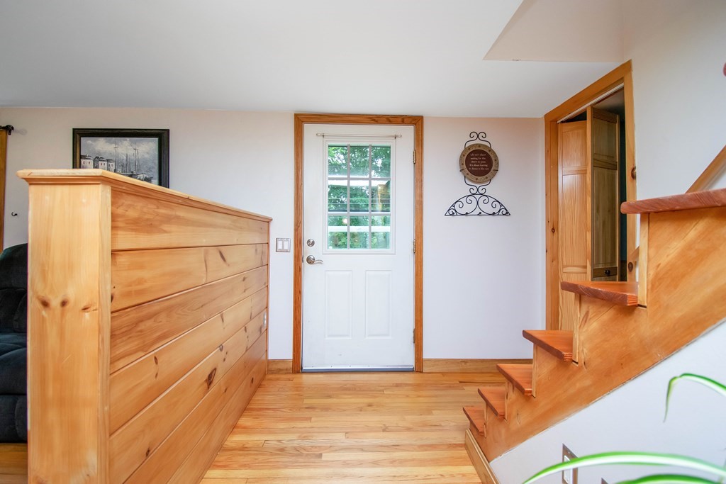 130 Warren Road Brimfield, MA 01010 - Photo 11 of 29 a view of a bedroom with wooden floor and cabinet