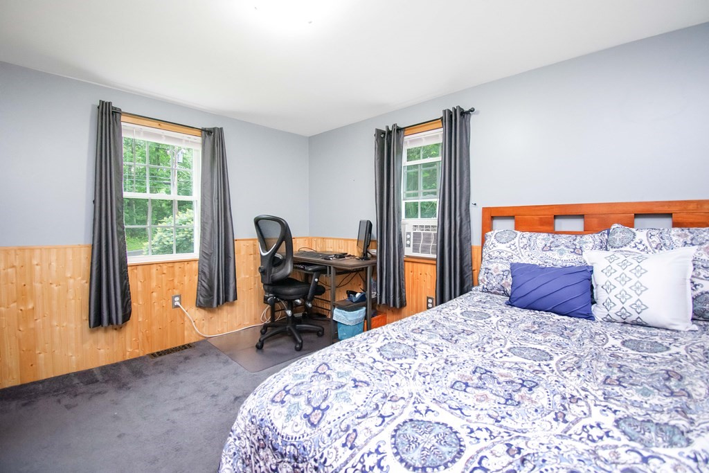 130 Warren Road Brimfield, MA 01010 - Photo 13 of 29 a bed sitting in a bedroom next to a window