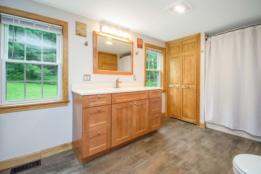 130 Warren Road Brimfield, MA 01010 - Photo 14 of 29 a spacious bathroom with a double vanity sink a mirror and a shower
